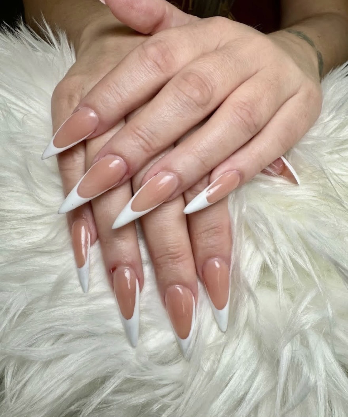 Long stiletto nude French tips