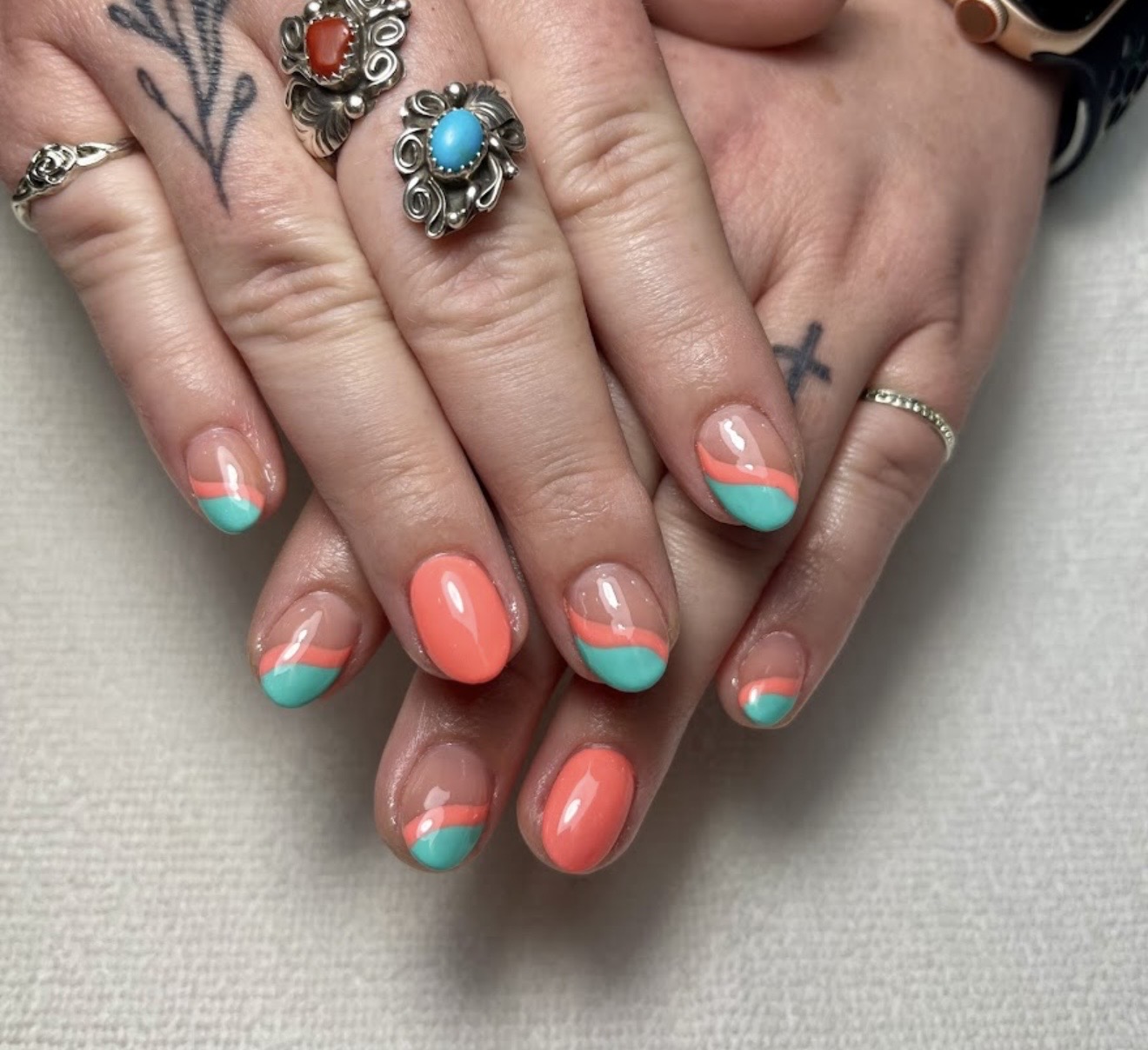 Coral and mint swirl nail art